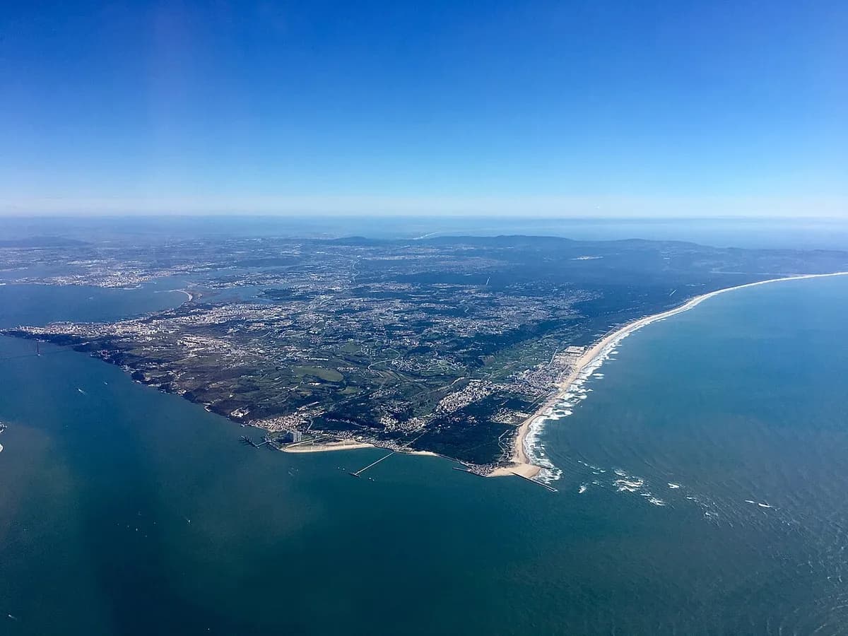 Praia da Fonte da Telha Sul expansive sandy beach popular with dog owners near Lisbon