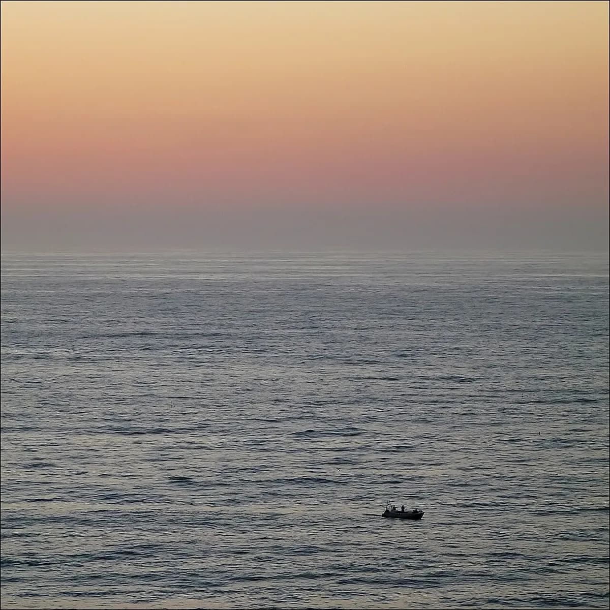 Praia de Vale Figueiras wide sandy beach backed by schist cliffs on the Algarve west coast, Portugal