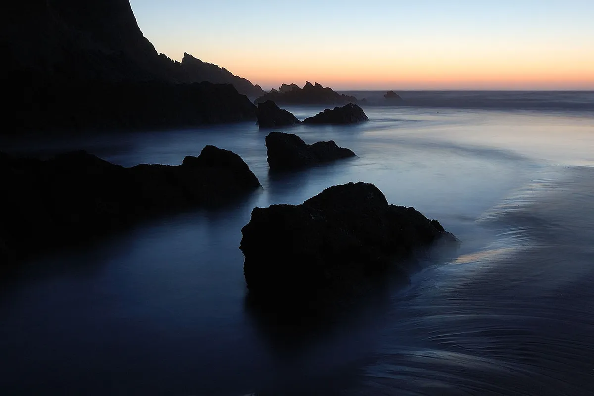 Praia do Brejo Largo wild golden sand beach with dramatic cliffs on the Alentejo coast